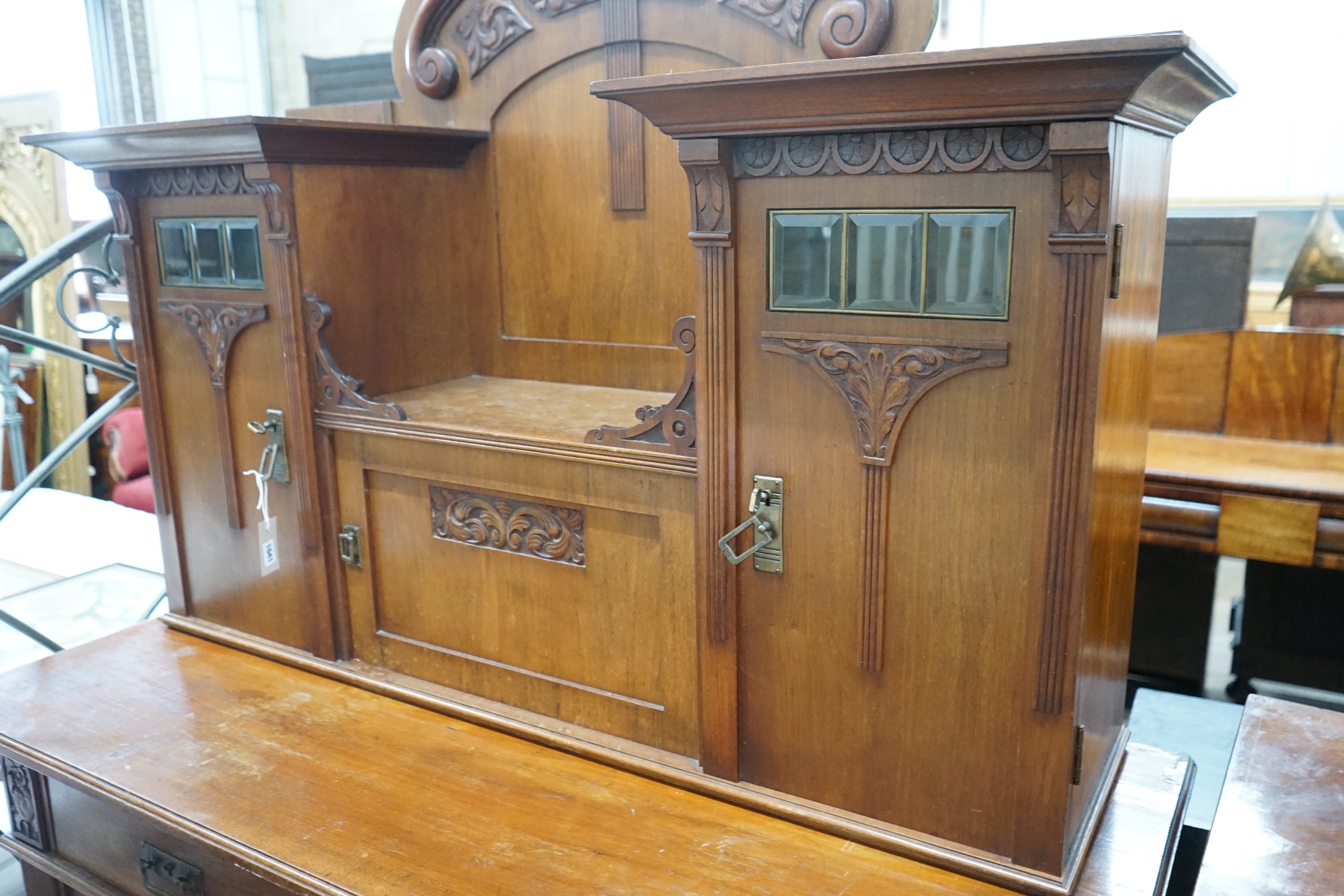 An early 20th century German Art Nouveau walnut buffet, length 141cm, depth 64cm, height 197cm